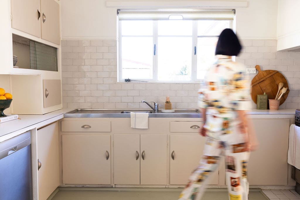 1950s Canberra red brick cottage utilitarian kitchen.