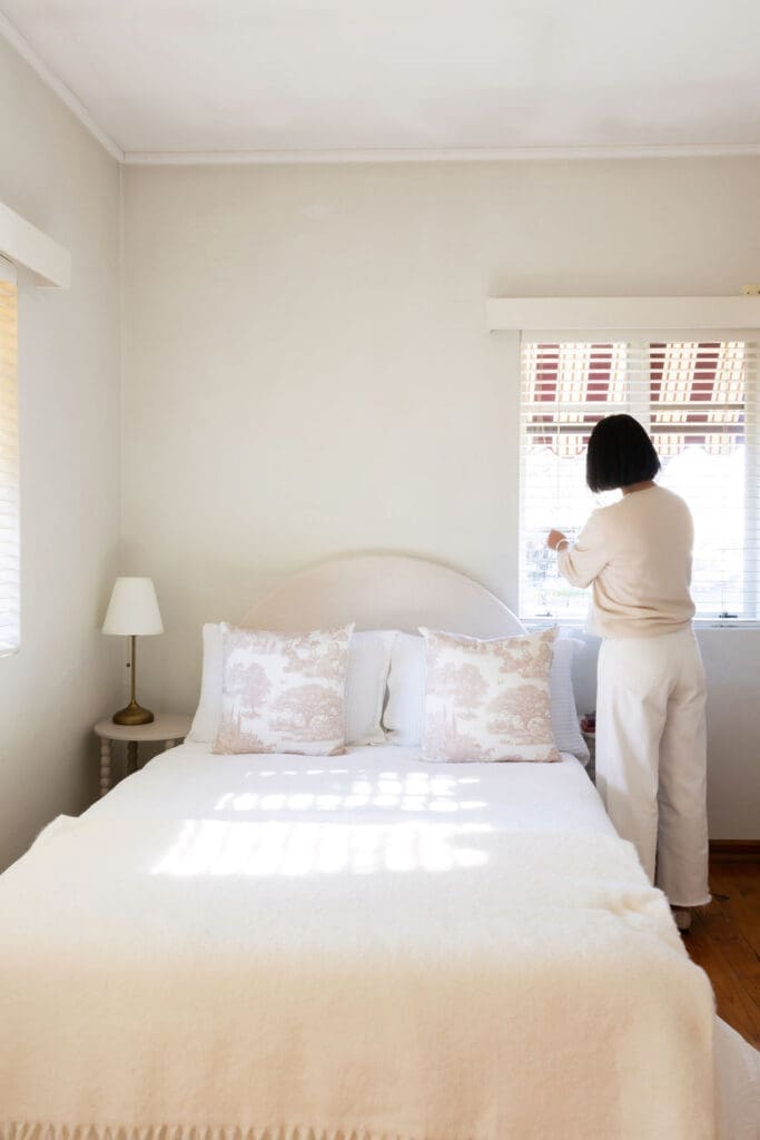 Dusty, muted tones and classic bedding. Staged by Dimora 